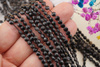 Czarny turmalin 2 gatunek (odbarwienia) / pastylka fasetowana / 4mm / sznur / około 90szt