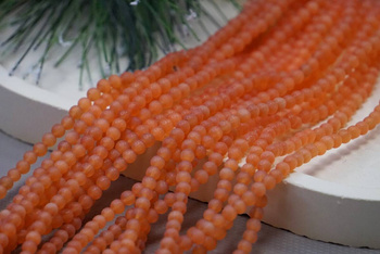 Kocie oko / kula matowa / 4mm / pomarańczowy / ok 90 szt / 1 sznur