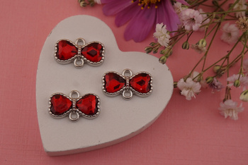 Kokardka z kryształkiem czerwonym / łącznik / metal / srebrny / 10,4x16,8mm/ 1szt